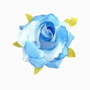 Close-up of a gradient blue glitter rose hair clip with green leaves on white backdrop
