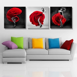 Three-piece wall art set featuring a red rose dancer over a white sofa in a modern living room