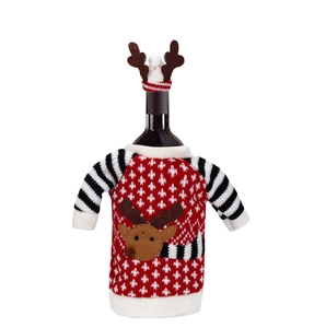 Detailed view of Christmas elk knitted wine bottle cover with mini sweater and antler hat