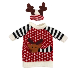 Close-up of a festive red knitted Christmas reindeer wine bottle cover with elk antlers