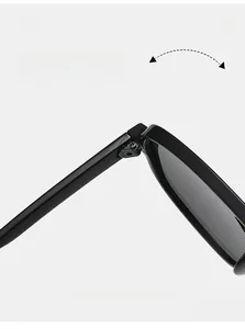 Detail showing the durable metal texture hinge of black minimalist double-bridge sunglasses
