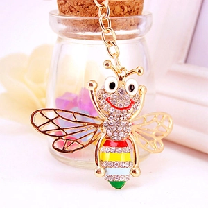 Cute golden bumblebee keychain with sparkling crystals and colorful enamel stripes