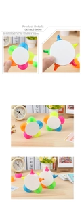 Detail shot of petal-shaped highlighter with five neon colors on a study desk