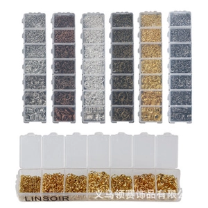 Close-up of multicolored stainless steel jump rings in 7-compartment storage box