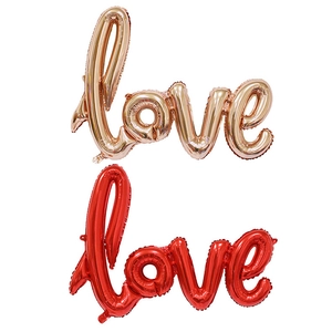 Rose gold and red foil LOVE script balloons for wedding and romantic decorations