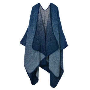 Detailed knit texture and gradient color flow on the navy blue thick poncho shawl