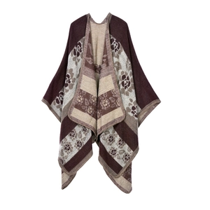 Close-up of knit texture with vintage floral and geometric patterns on a warm shawl