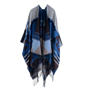 Thick cashmere-feel geometric poncho with blue and brown patterns and black fringe