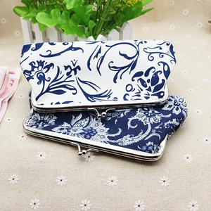 Detail of fabric clasp coin purses with vintage blue and white floral patterns