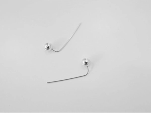 Detailed close-up of minimalist S925 sterling silver ball drop earrings with polished finish