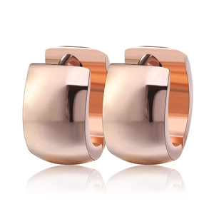 Polished rose gold stainless steel huggie hoop earrings for women on white background