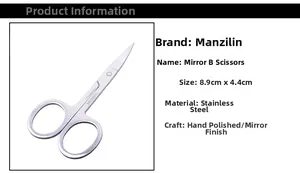 Macro view of mirror polished stainless steel scissors measuring 8.9cm x 4.4cm