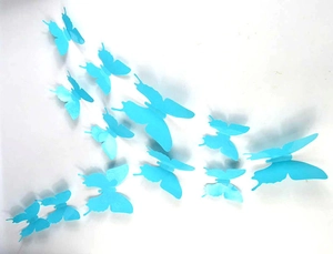 Macro shot of 3D light blue PVC butterfly wall stickers with realistic folded wings