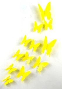 Detailed top view of 12 yellow 3D PVC butterfly wall stickers on a white background