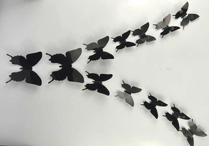 Set of 12 black 3D PVC butterfly wall stickers in various sizes for DIY home decoration