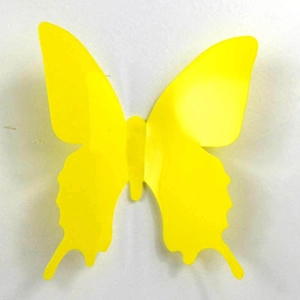 Close-up of a single vibrant yellow PVC butterfly wall sticker for creative DIY home decor