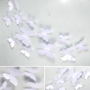 Detailed view of 3D white butterfly wall stickers in various sizes for DIY decoration