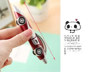 Detail showing the 12.4cm length of a racing car shaped ballpoint pen in red and silver