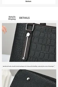 Detail of black crocodile embossed leather handbag with shiny silver hardware reinforcement