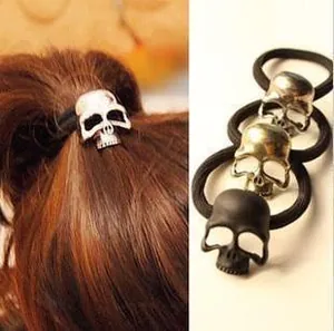Detail of skull hair ties in gold, silver, and matte black with high-elastic bands