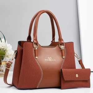 Caramel retro faux leather handbag and envelope clutch set with white stitching and strap