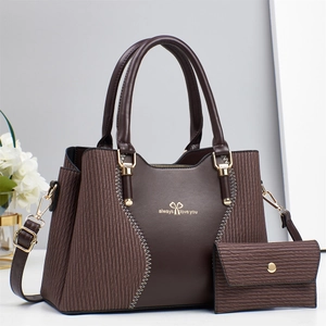 Dark brown leather tote bag with long wallet set featuring wavy texture and gold logo