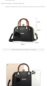 Detailed size view of black lychee leather handbag with amber handle and dimensions