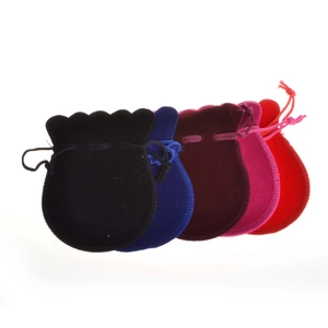 Five assorted velvet drawstring jewelry pouches in black, blue, burgundy, pink, and red