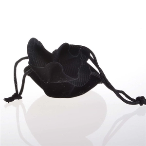 Close-up of a small black velvet drawstring pouch for jewelry on white background