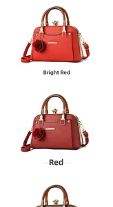 Detail of red leather tote bag showing amber acrylic handles and flower charm pendant