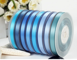 Detail of 6mm blue gradient satin ribbon roll for floral cake packaging and DIY crafts