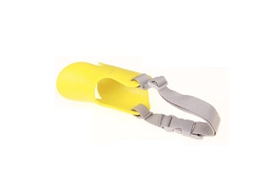 Detail view of yellow duckbill dog muzzle with adjustable gray strap for anti-biting