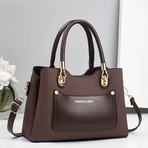 Elegant brown pleated shoulder bag with smooth leather pocket and golden metallic handles