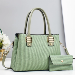 Light green pleated textured handbag set with matching purse and gold hardware