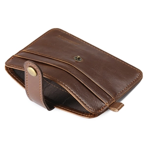 Detail view of brown leather card holder featuring multi-slots and snap closure
