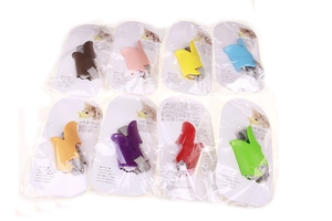 Detail of colorful duck-billed dog muzzles in size S with adjustable nylon straps