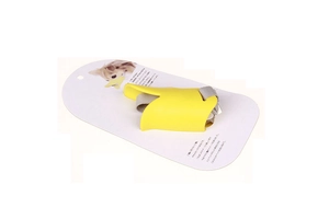 Macro detail of yellow duck-bill silicone dog muzzle with adjustable strap and retail packaging