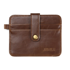 Detailed view of brown leather card holder with snap button and JINBAOLAI logo