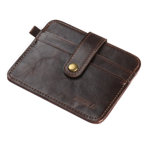 Close-up of dark brown leather card holder with multiple slots and metal snap button
