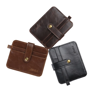 Three leather slim wallets in brown and black with snap closures and multi-card slots