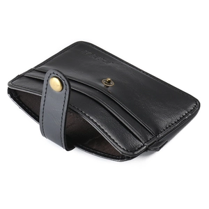 Detailed view of black leather card holder with multiple slots and vintage metal snap button