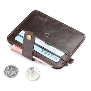 Detail view of coffee brown litchi pattern card holder with antique bronze snap closure