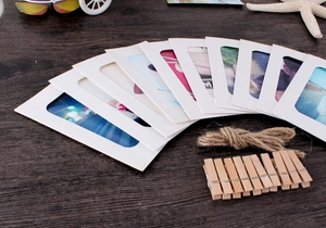 Set of 10 white paper photo frames with hemp rope and wooden clips for DIY wall decor