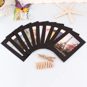 Detail of 10 black paper picture frames with mini wooden clips and natural jute twine cord