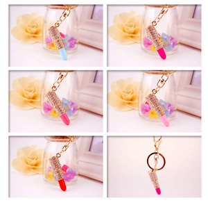 Collage showing various colors of sparkling rhinestone lipstick keychains for handbags