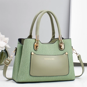 Elegant light green pleated leather handbag with gold hardware and dual carry straps