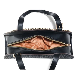 Detail view of black embossed tote with golden zipper and spacious brown fabric lining