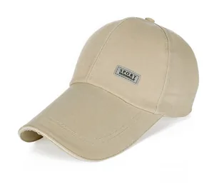 Detail shot of khaki canvas baseball cap with long brim and reflective sport label