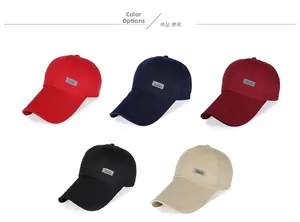 Detail view of cotton baseball caps with long brims and stitched reflective SPORT label