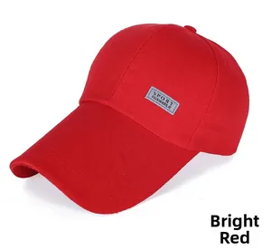 Detail of red canvas baseball cap featuring grey SPORT leather patch and durable stitching